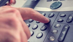 upclose-of-finger-dialing-on-a-phone
